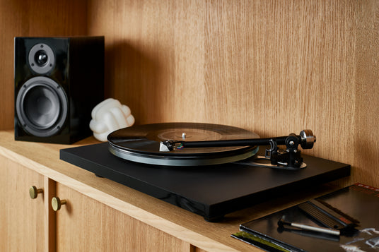 2MR cartridge displayed on a turntable with a loudspeaker in the background